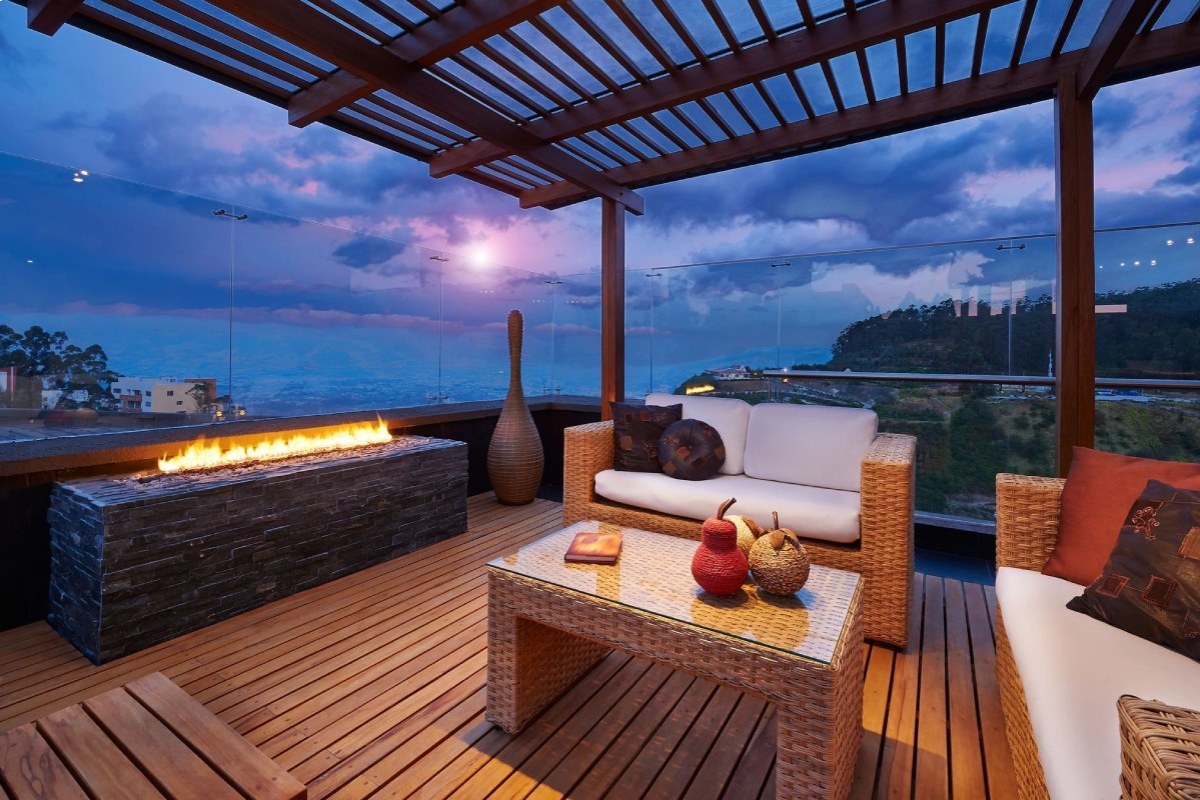 Balcony with furniture and fire place